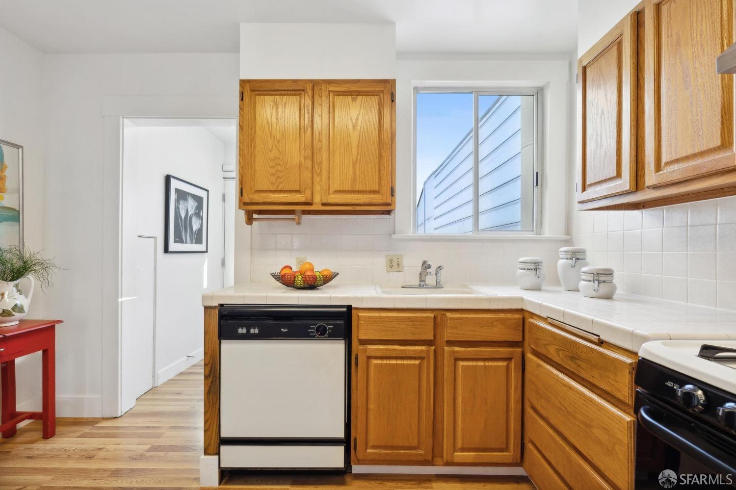 686 29th Avenue San Francisco, CA 94121 - Photo 39 of 69 a kitchen with stainless steel appliances granite countertop a sink and cabinets
