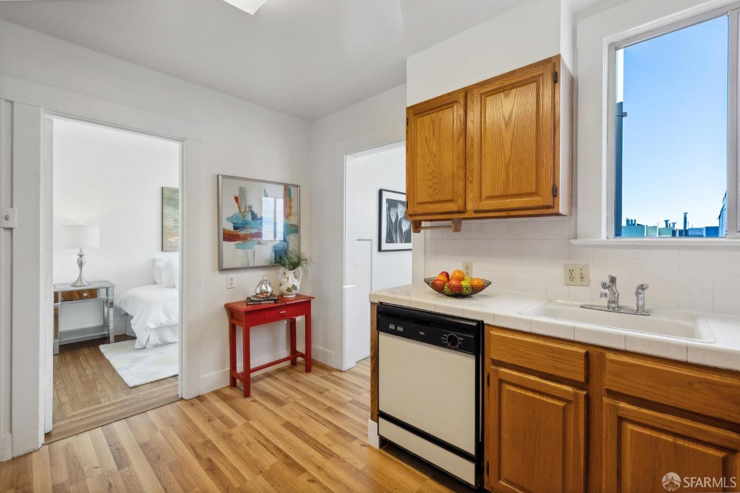 686 29th Avenue San Francisco, CA 94121 - Photo 41 of 69 a kitchen with stainless steel appliances granite countertop a sink and a wooden floors