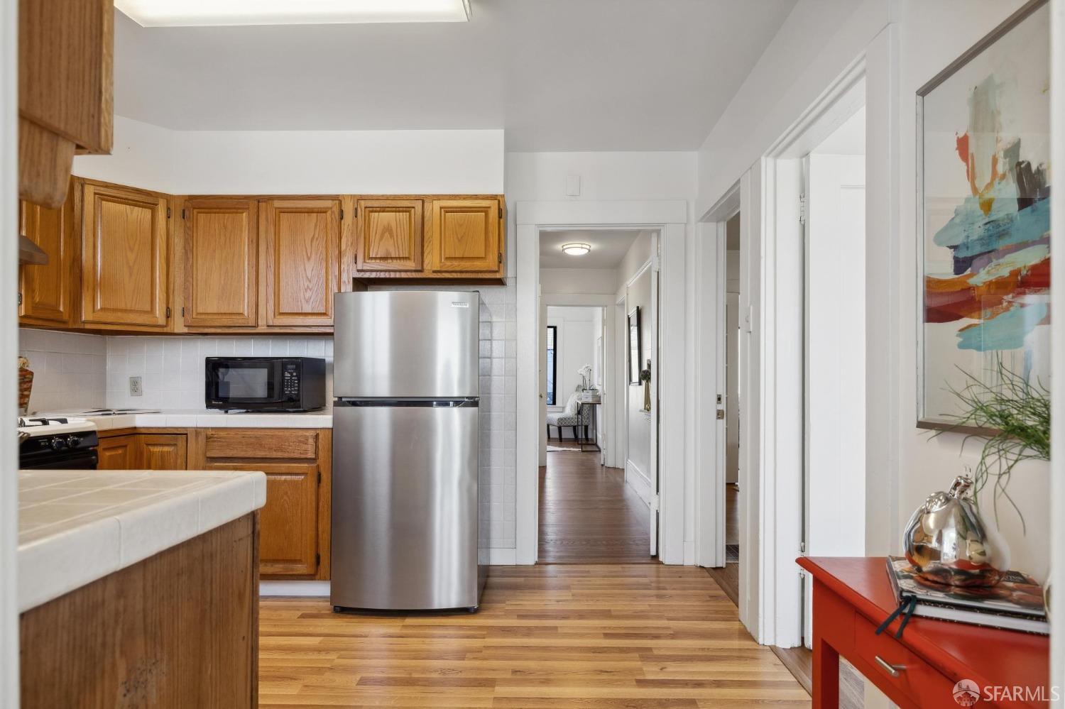686 29th Avenue San Francisco, CA 94121 - Photo 42 of 69 a kitchen with stainless steel appliances granite countertop a refrigerator and a stove top oven
