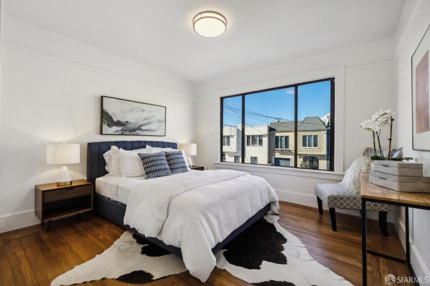 686 29th Avenue San Francisco, CA 94121 - Photo 43 of 69 a bedroom with a bed and a table in it