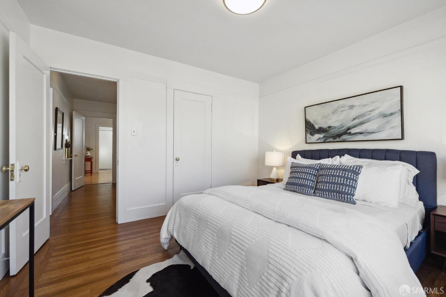 686 29th Avenue San Francisco, CA 94121 - Photo 44 of 69 a bedroom with a bed and wooden floor