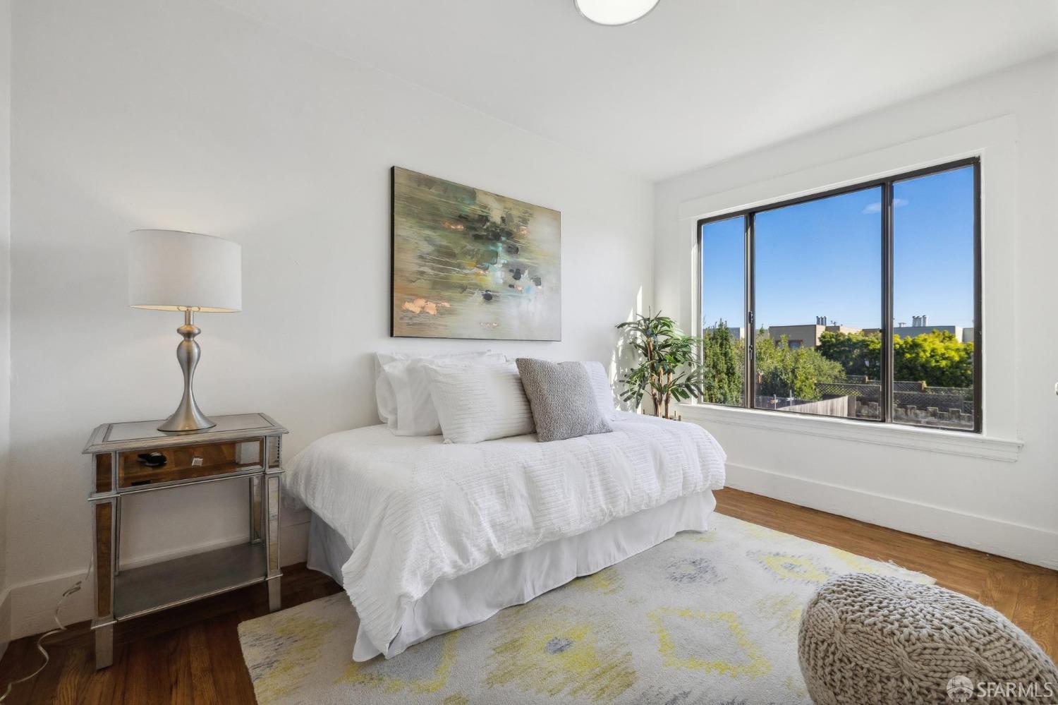 686 29th Avenue San Francisco, CA 94121 - Photo 47 of 69 a bedroom with a bed and a couch