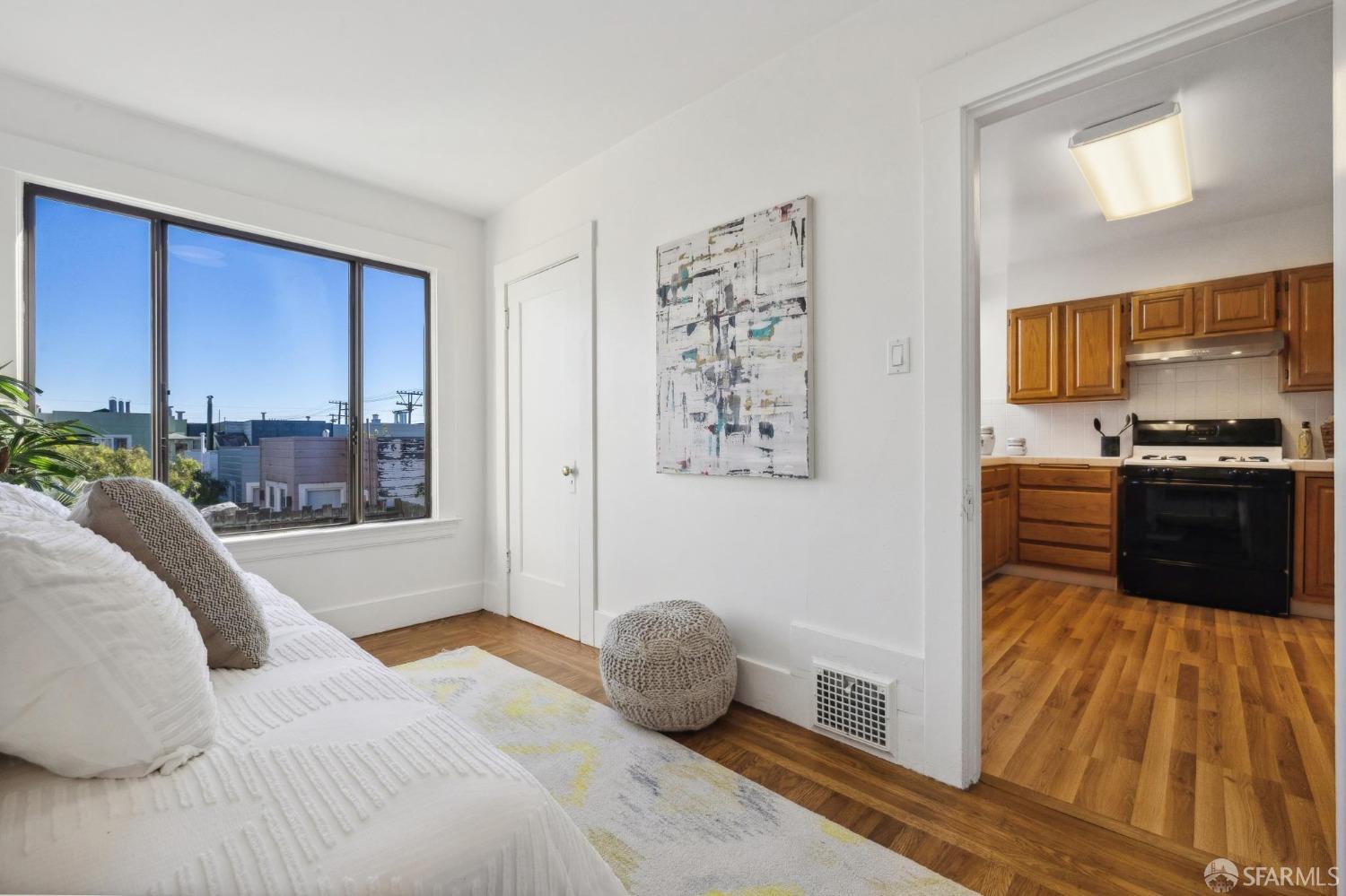 686 29th Avenue San Francisco, CA 94121 - Photo 50 of 69 a bedroom with a bed and a dresser