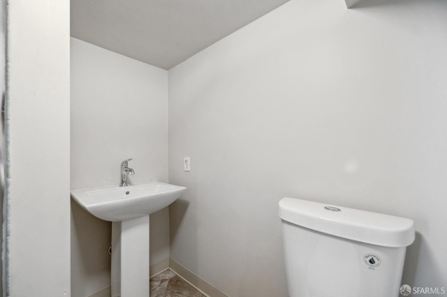 686 29th Avenue San Francisco, CA 94121 - Photo 69 of 69 a bathroom with a sink a toilet and a mirror