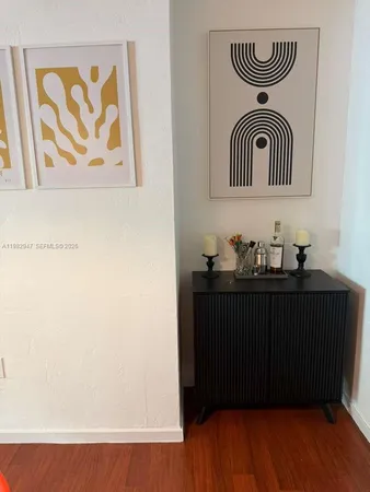 a view of a utility room with wooden floor