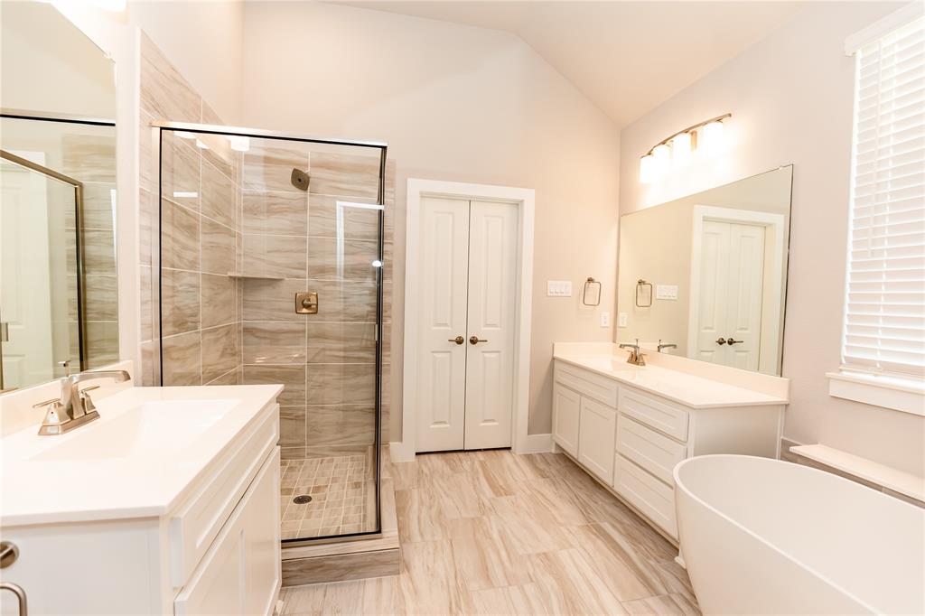 6124 Shasta Creek Road Celina, TX 75009 - Photo 12 of 27 a bathroom with a tub sink and mirror