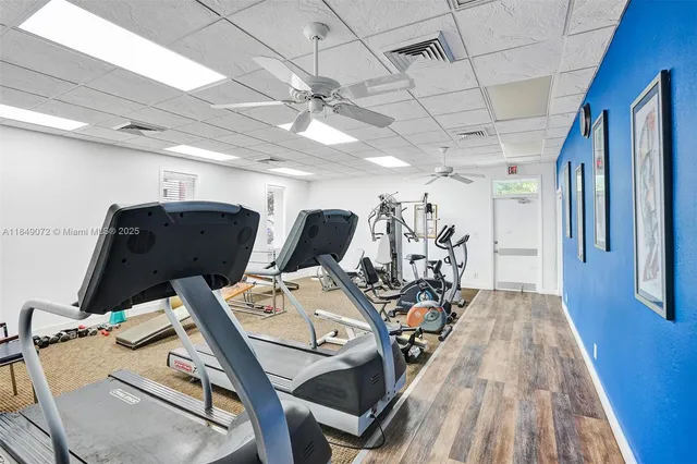 a room with gym equipment and a mirror