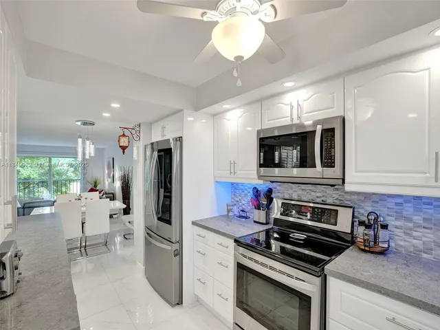 a kitchen with a stove and a microwave
