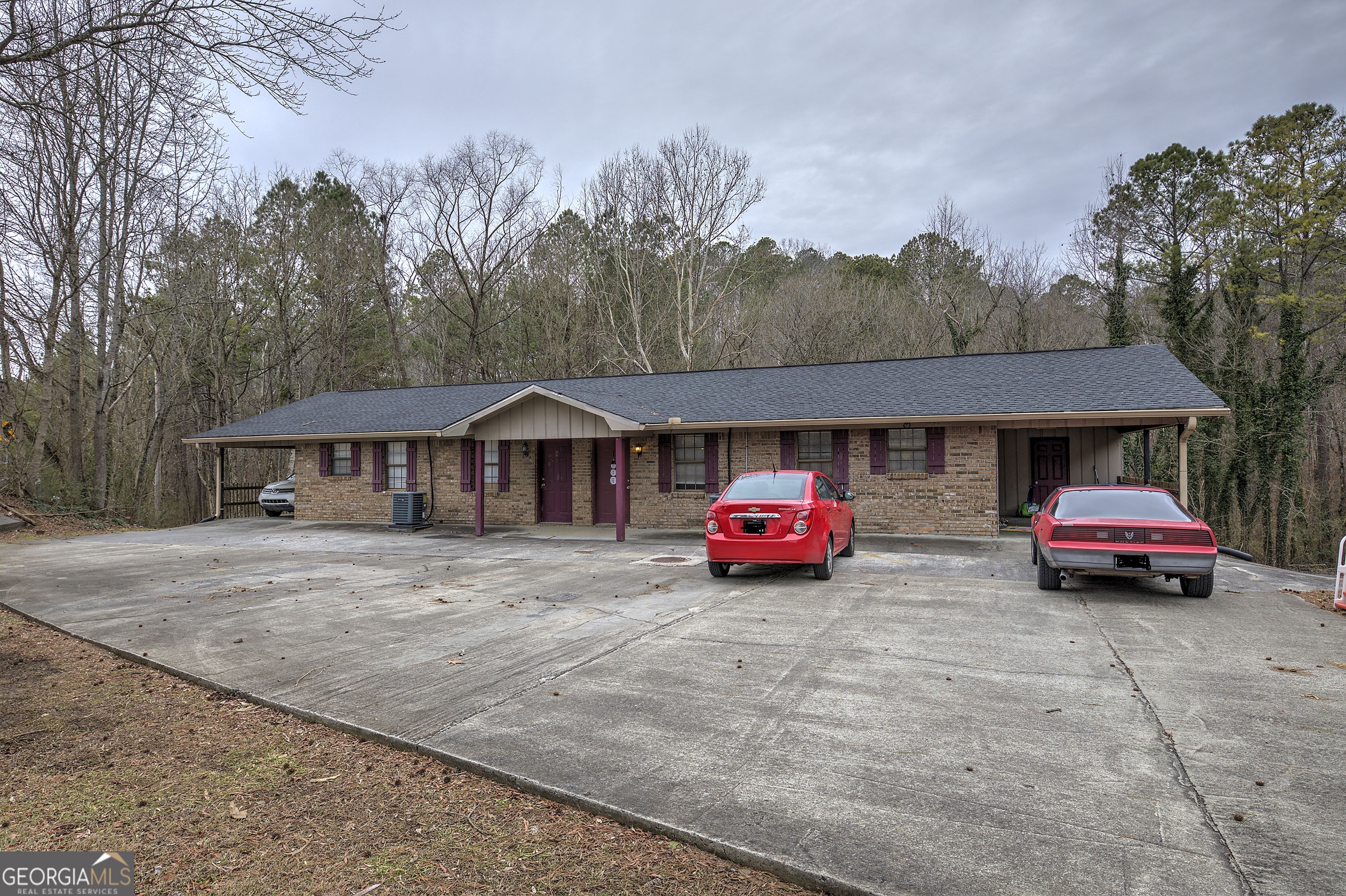 a view of a cars parked in front of a house
