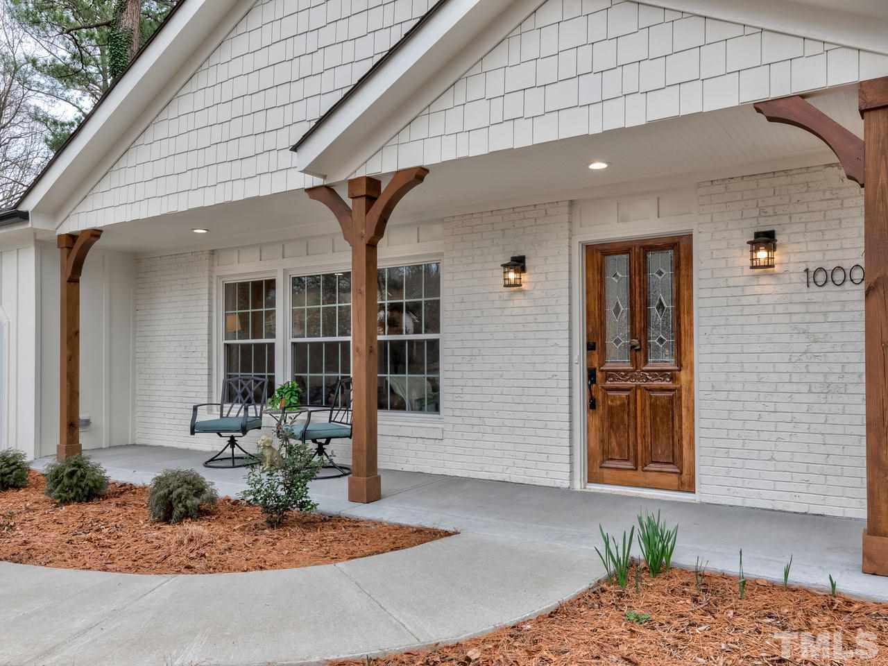 1000 Deerfield Road Raleigh, NC 27609 - Photo 3 of 30 Covered front porch with wood posts. Front door is original and refurbished - so charming!