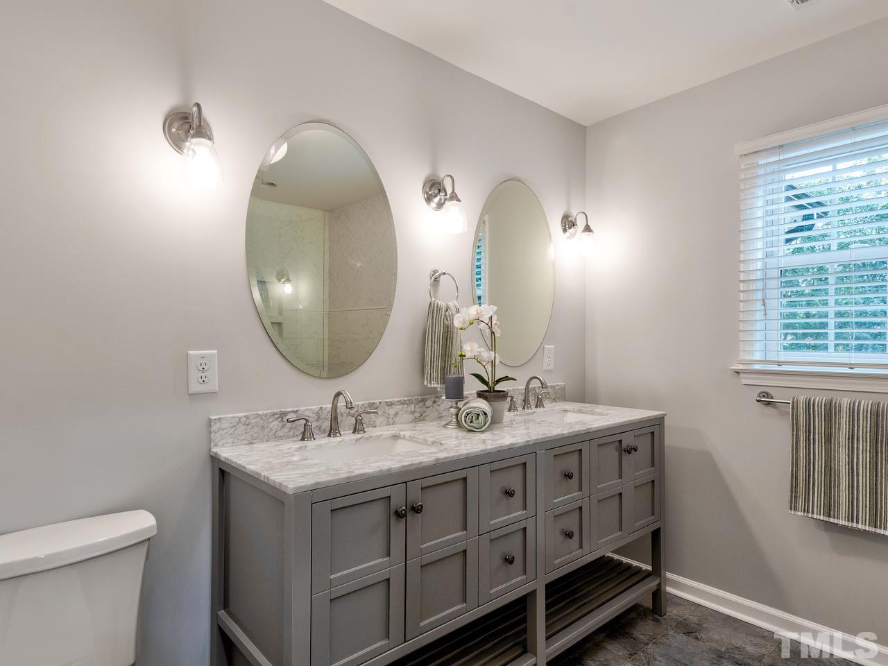 1000 Deerfield Road Raleigh, NC 27609 - Photo 22 of 30 Raised height double vanity with quartz counter top has plenty of storage.