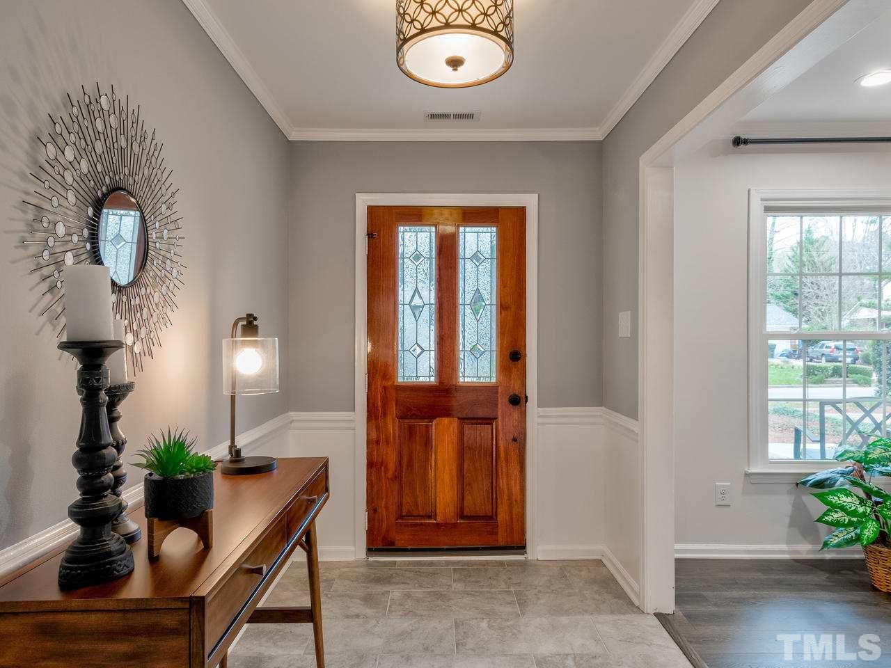 1000 Deerfield Road Raleigh, NC 27609 - Photo 4 of 30 Inviting front entry with tile floor and chair rail molding.