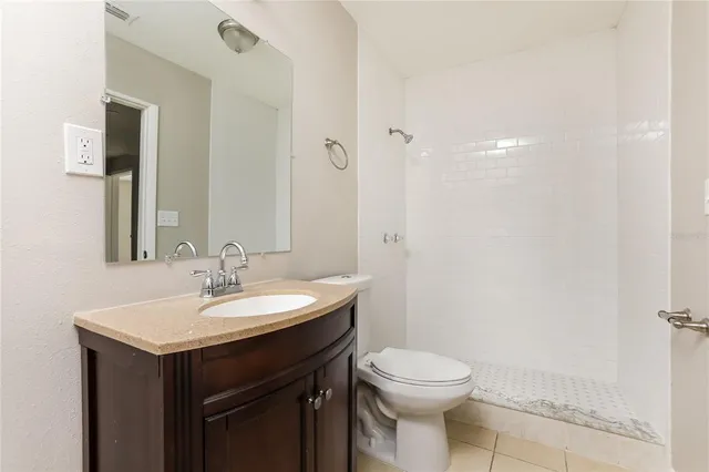 a bathroom with a sink toilet and vanity