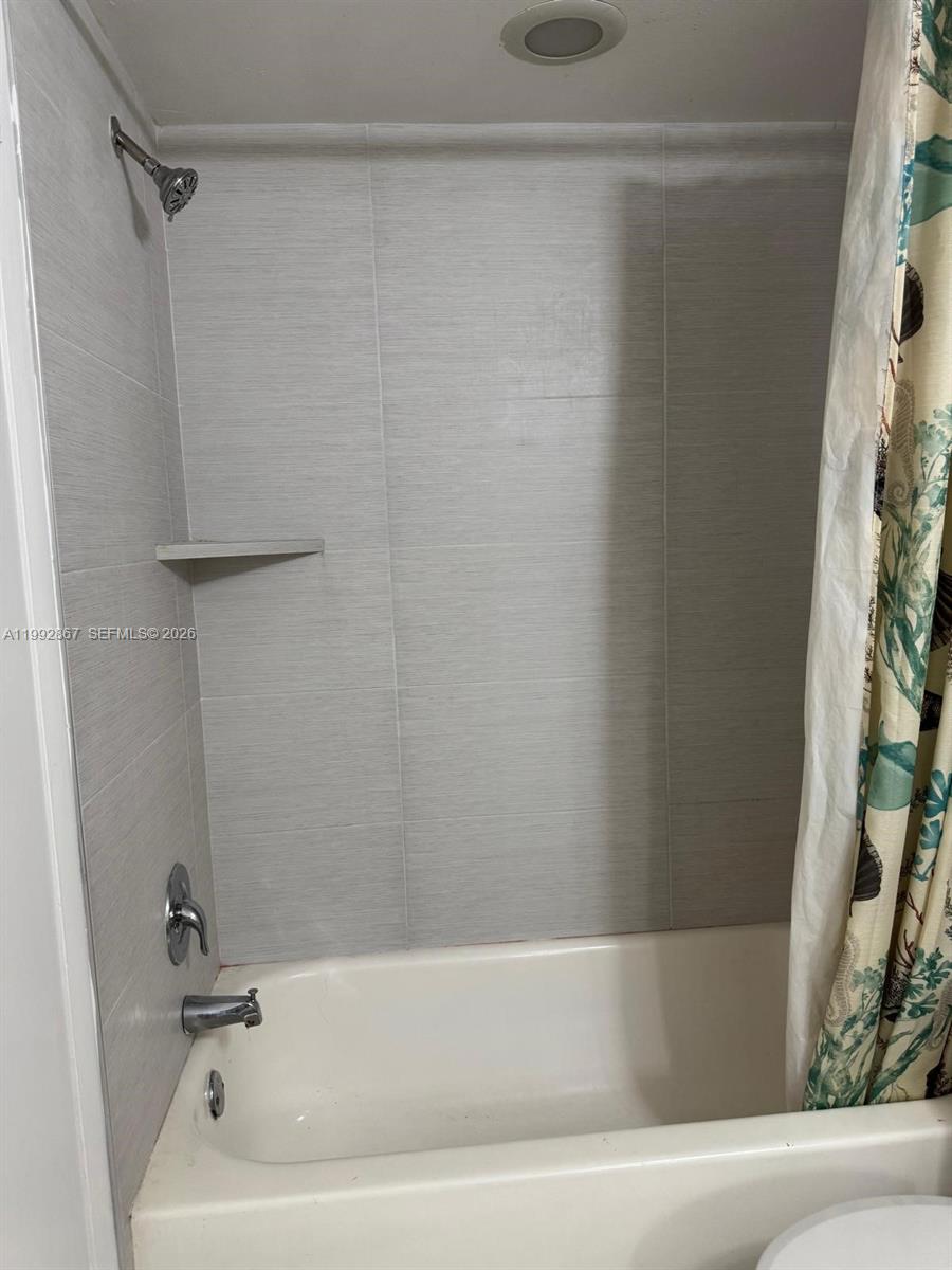 5760 Rock Island Road, Unit 304 Tamarac, FL 33319 - Photo 12 of 40 a bathroom with a bathtub