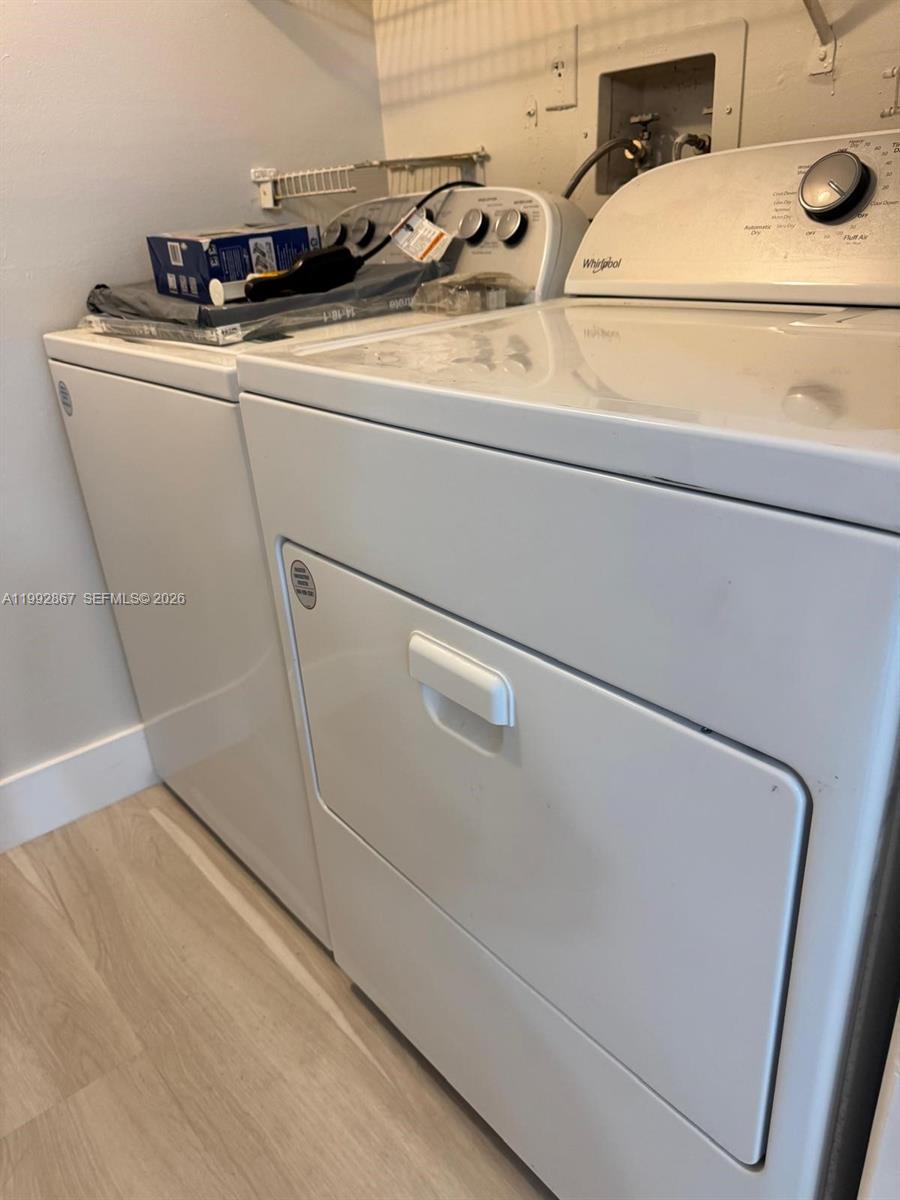 5760 Rock Island Road, Unit 304 Tamarac, FL 33319 - Photo 14 of 40 a utility room with dryer and washer