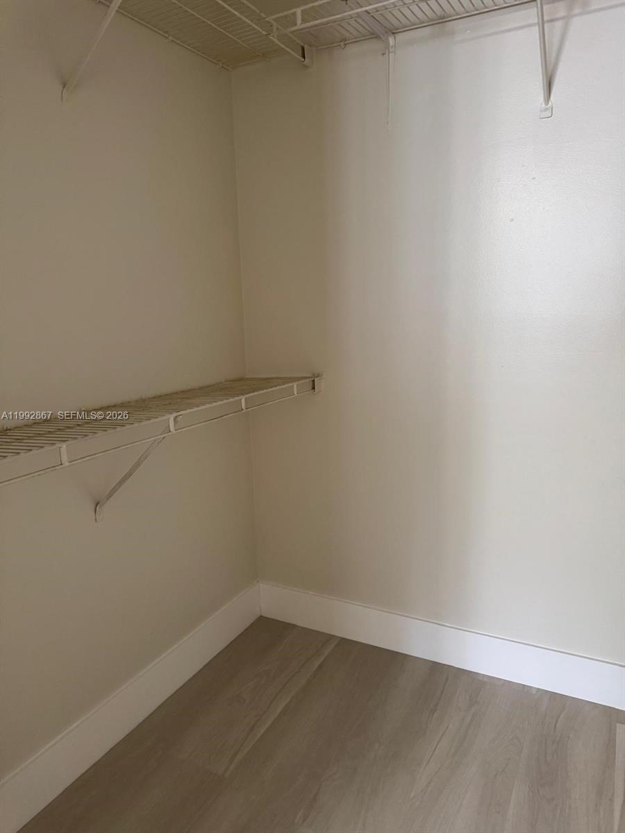 5760 Rock Island Road, Unit 304 Tamarac, FL 33319 - Photo 15 of 40 a view of an empty walk in closet