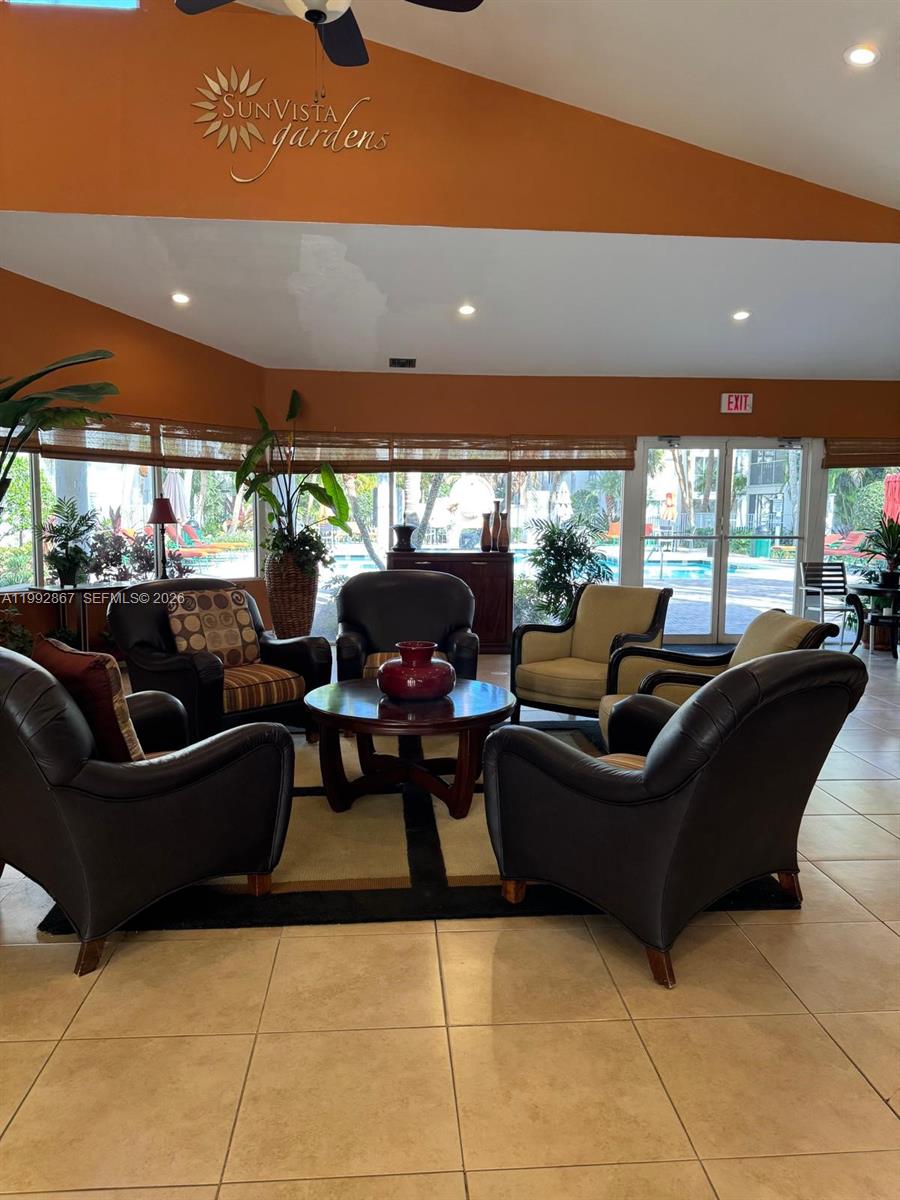 5760 Rock Island Road, Unit 304 Tamarac, FL 33319 - Photo 21 of 40 a living room with furniture and a large window