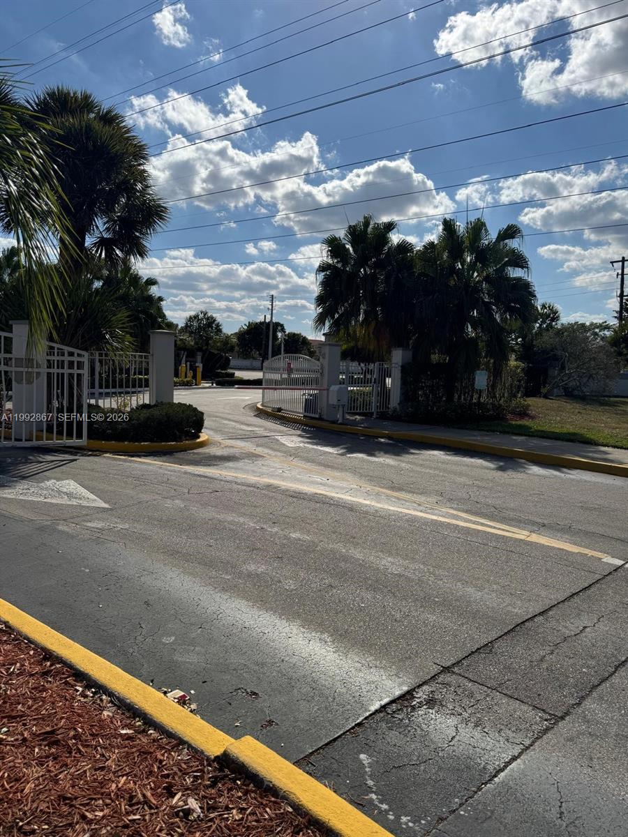 5760 Rock Island Road, Unit 304 Tamarac, FL 33319 - Photo 37 of 40 a view of street with houses
