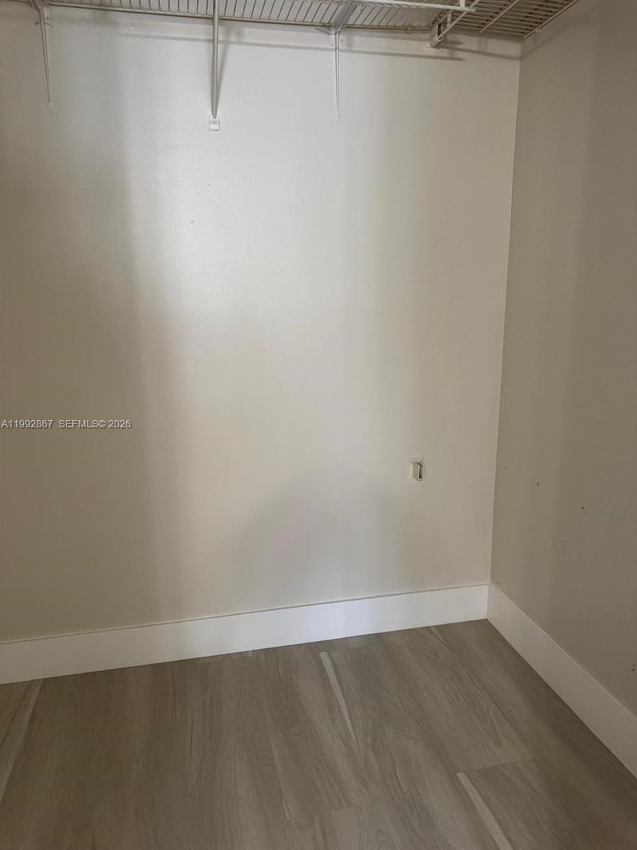 5760 Rock Island Road, Unit 304 Tamarac, FL 33319 - Photo 9 of 40 a view of a room with an empty shelf