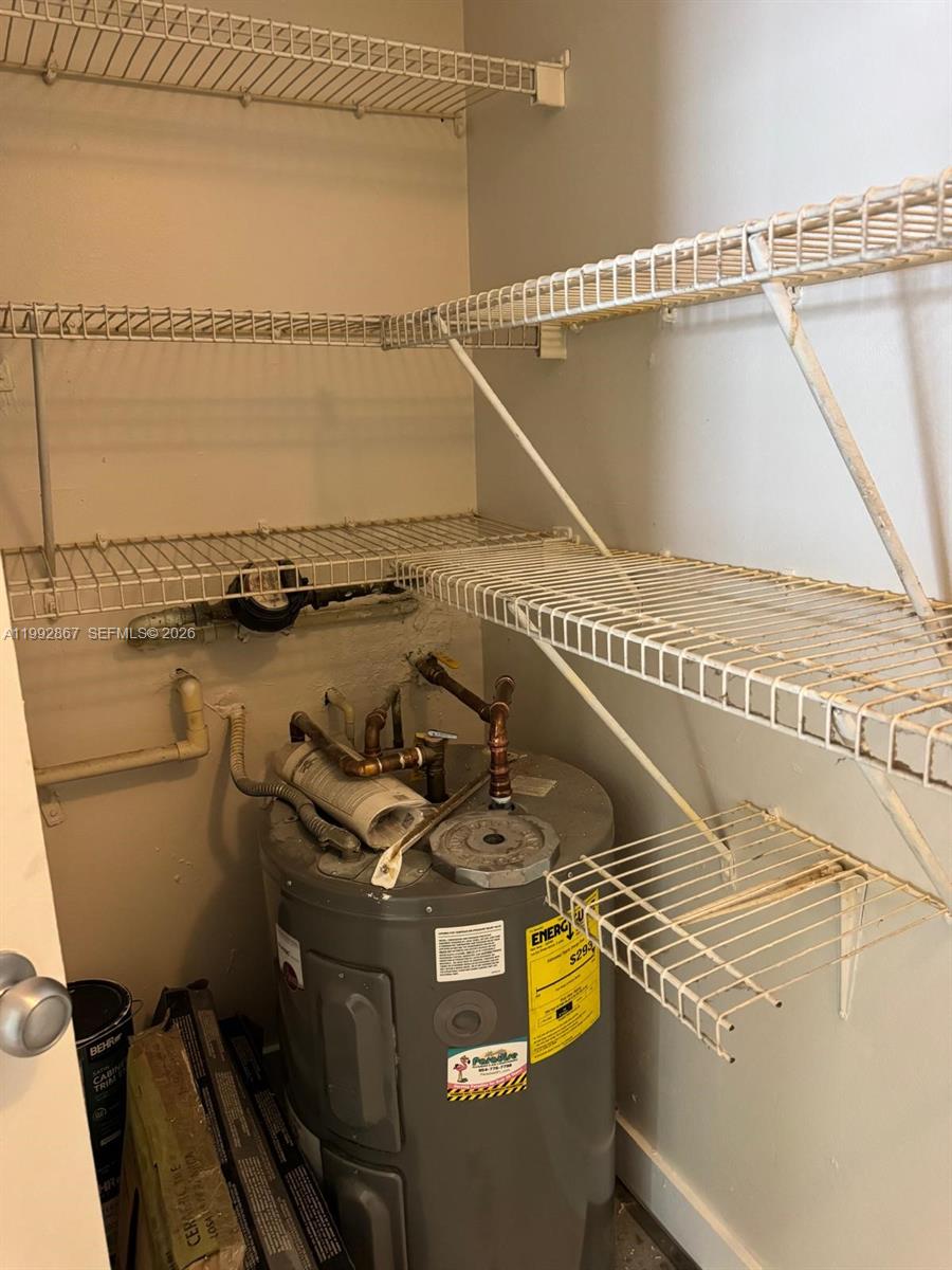 5760 Rock Island Road, Unit 304 Tamarac, FL 33319 - Photo 10 of 40 a utility room with dryer and washer