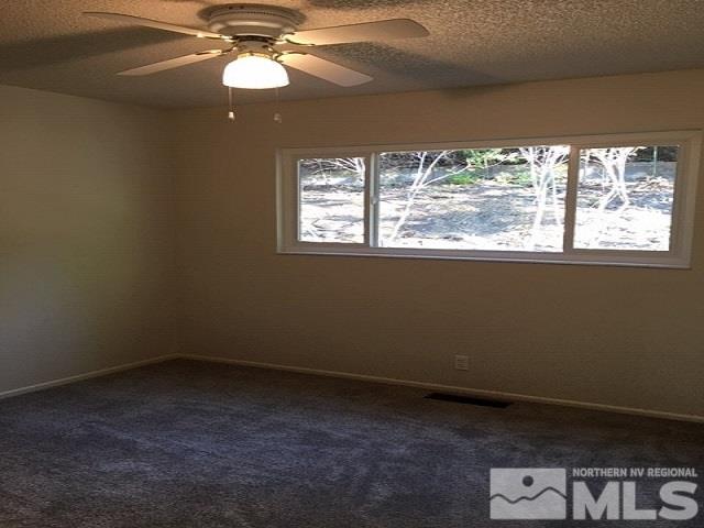 40 Kaye Way Reno, NV 89509 - Photo 8 of 17 a view of an empty room with a window