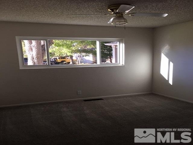 40 Kaye Way Reno, NV 89509 - Photo 9 of 17 a view of an empty room with a window