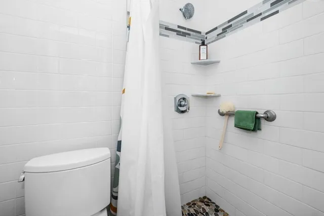 a view of a cars park in front of a house