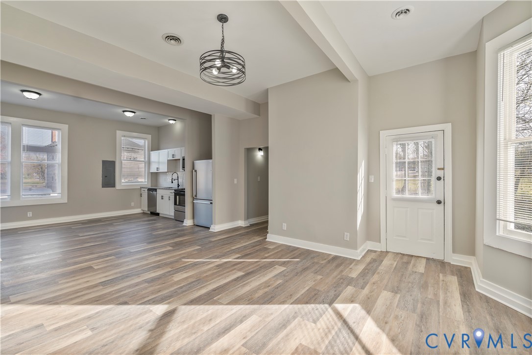 22 Corling Street Petersburg, VA 23803 - Photo 2 of 16 Unfurnished living room with healthy amount of nat