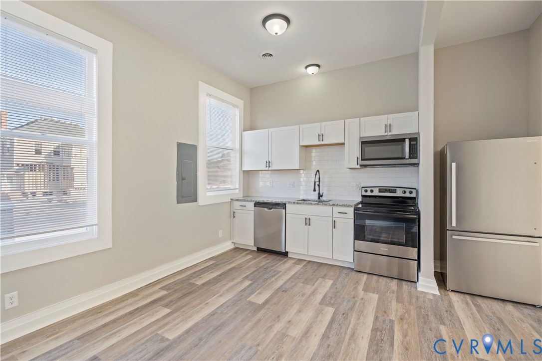 22 Corling Street Petersburg, VA 23803 - Photo 3 of 16 Kitchen with stainless steel appliances, tasteful