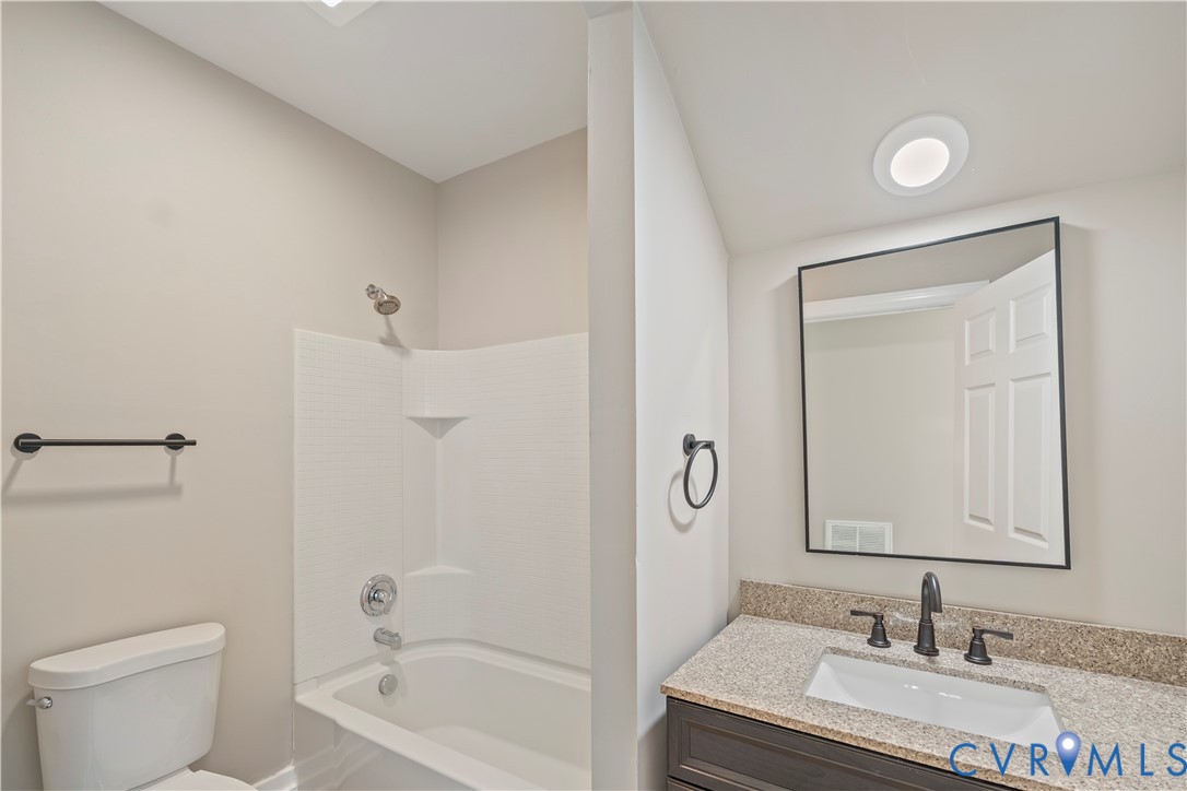 22 Corling Street Petersburg, VA 23803 - Photo 4 of 16 Full bath featuring vanity and bathtub / shower co