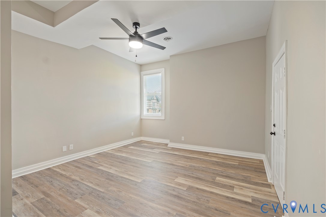 22 Corling Street Petersburg, VA 23803 - Photo 6 of 16 Spare room with light wood-type flooring and ceili