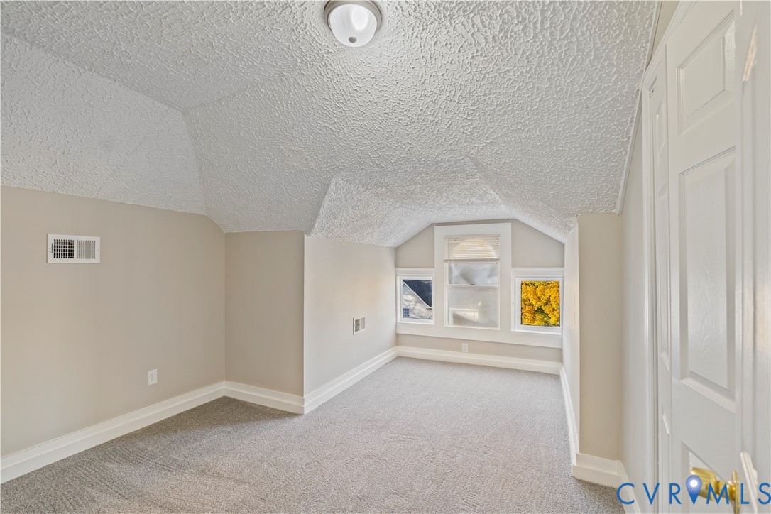 22 Corling Street Petersburg, VA 23803 - Photo 9 of 16 Additional living space with carpet floors, a text