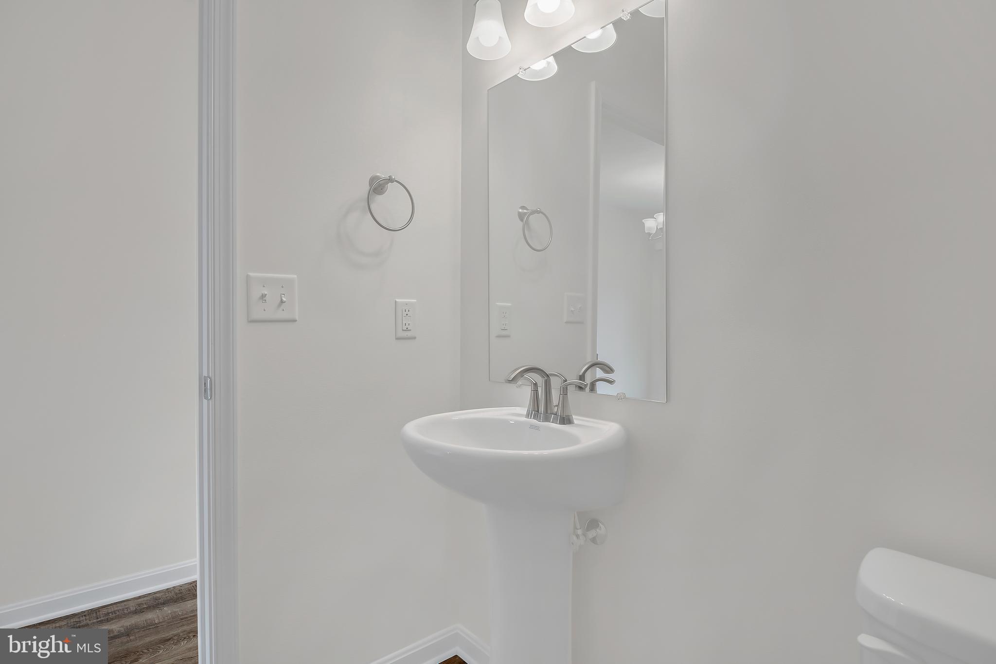 0 H Street, Unit 17 Carlisle, PA 17013 - Photo 9 of 19 a bathroom with a sink a toilet and a mirror