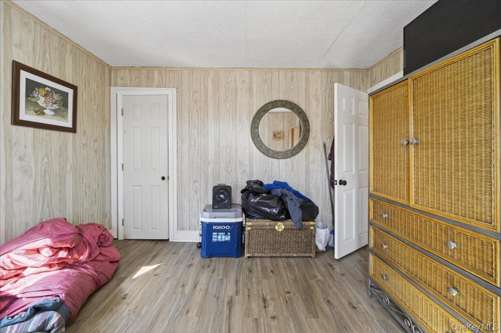 67 Main Street Bloomingburg, NY 12721 - Photo 5 of 29 a living room with furniture and a wooden floor