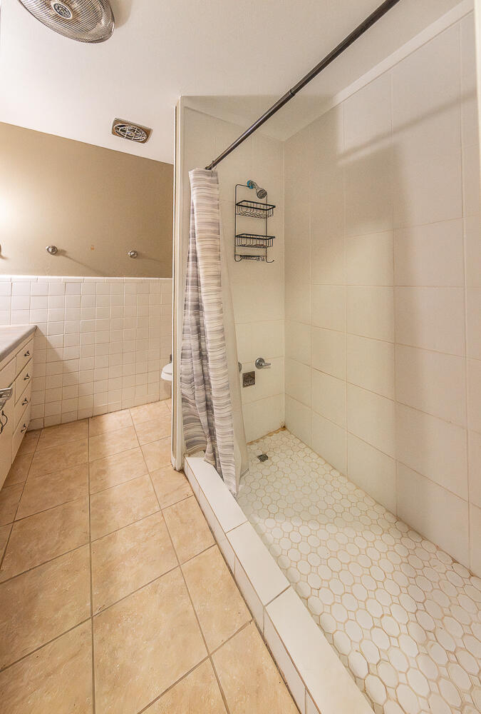 4604 31st Street Lubbock, TX 79410 - Photo 12 of 25 a bathroom with a shower