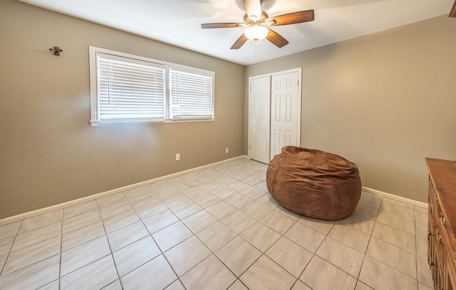 4604 31st Street Lubbock, TX 79410 - Photo 14 of 25 a view of a livingroom with furniture and chandelier fan