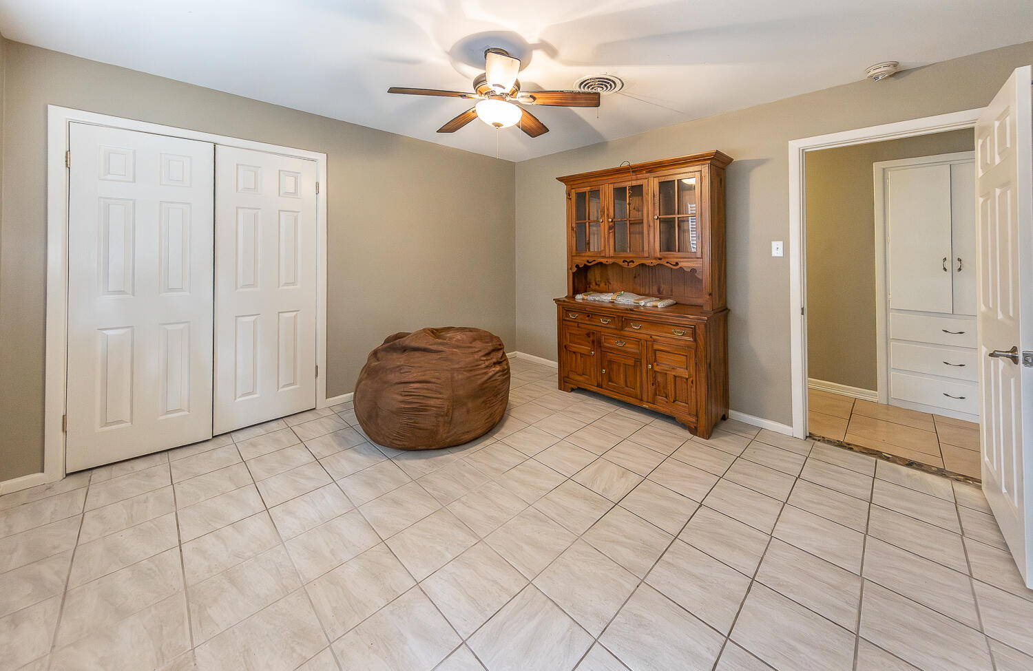 4604 31st Street Lubbock, TX 79410 - Photo 15 of 25 a view of a windows and chandelier fan in a room