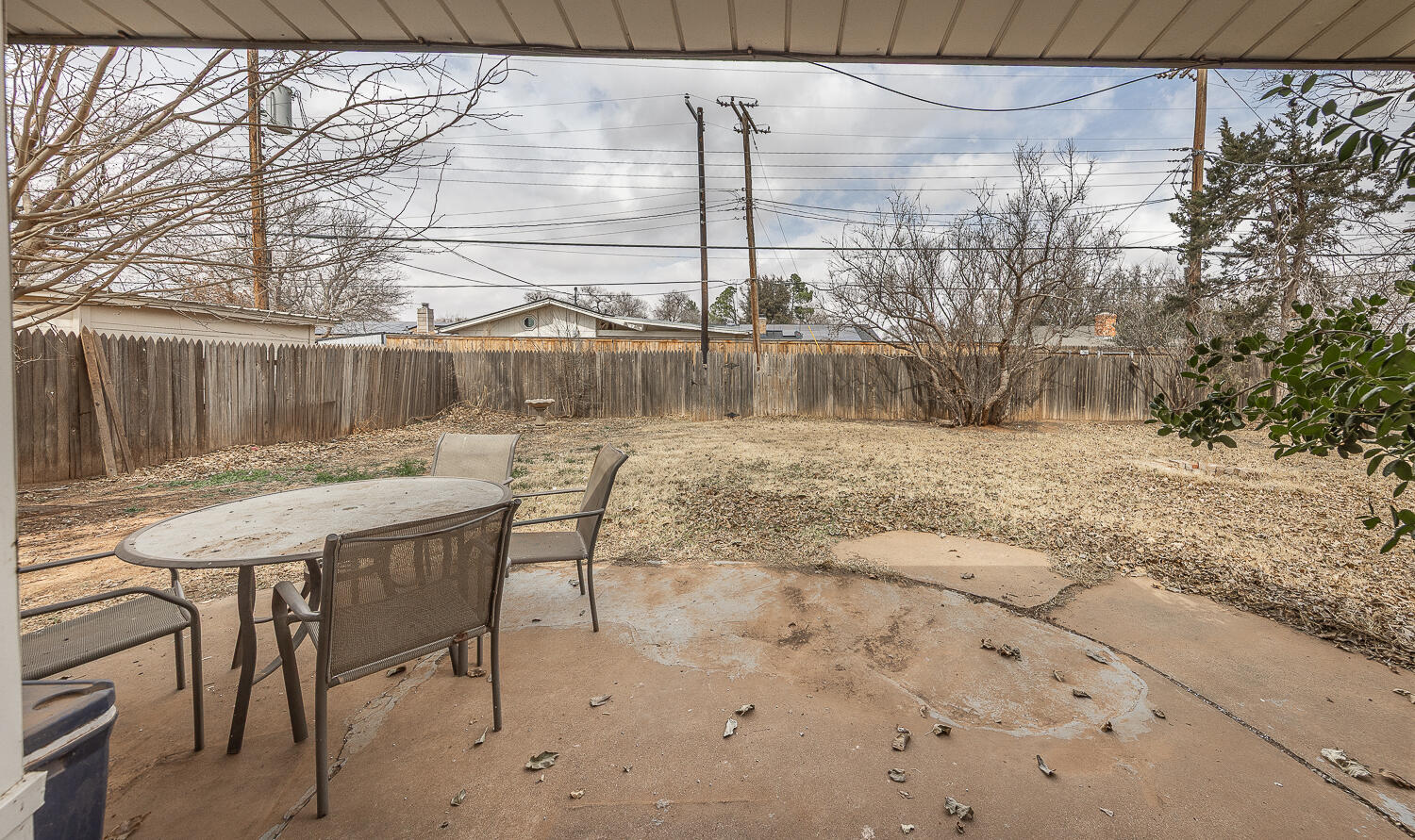 4604 31st Street Lubbock, TX 79410 - Photo 21 of 25 a view of a backyard with a table and chairs