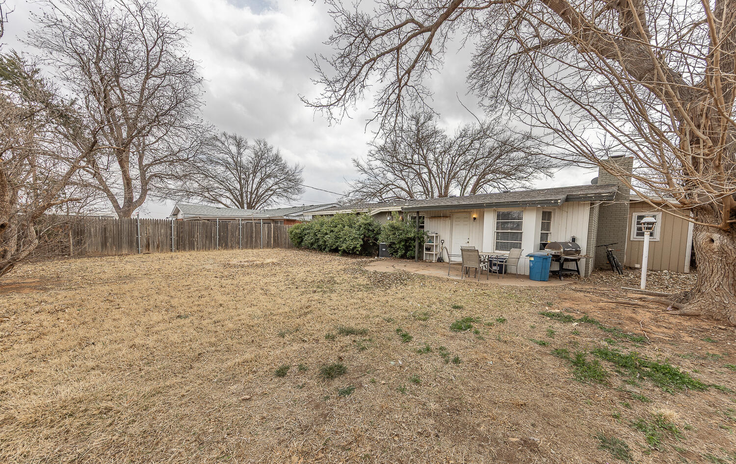 4604 31st Street Lubbock, TX 79410 - Photo 22 of 25 a view of a house with a yard covered in snow