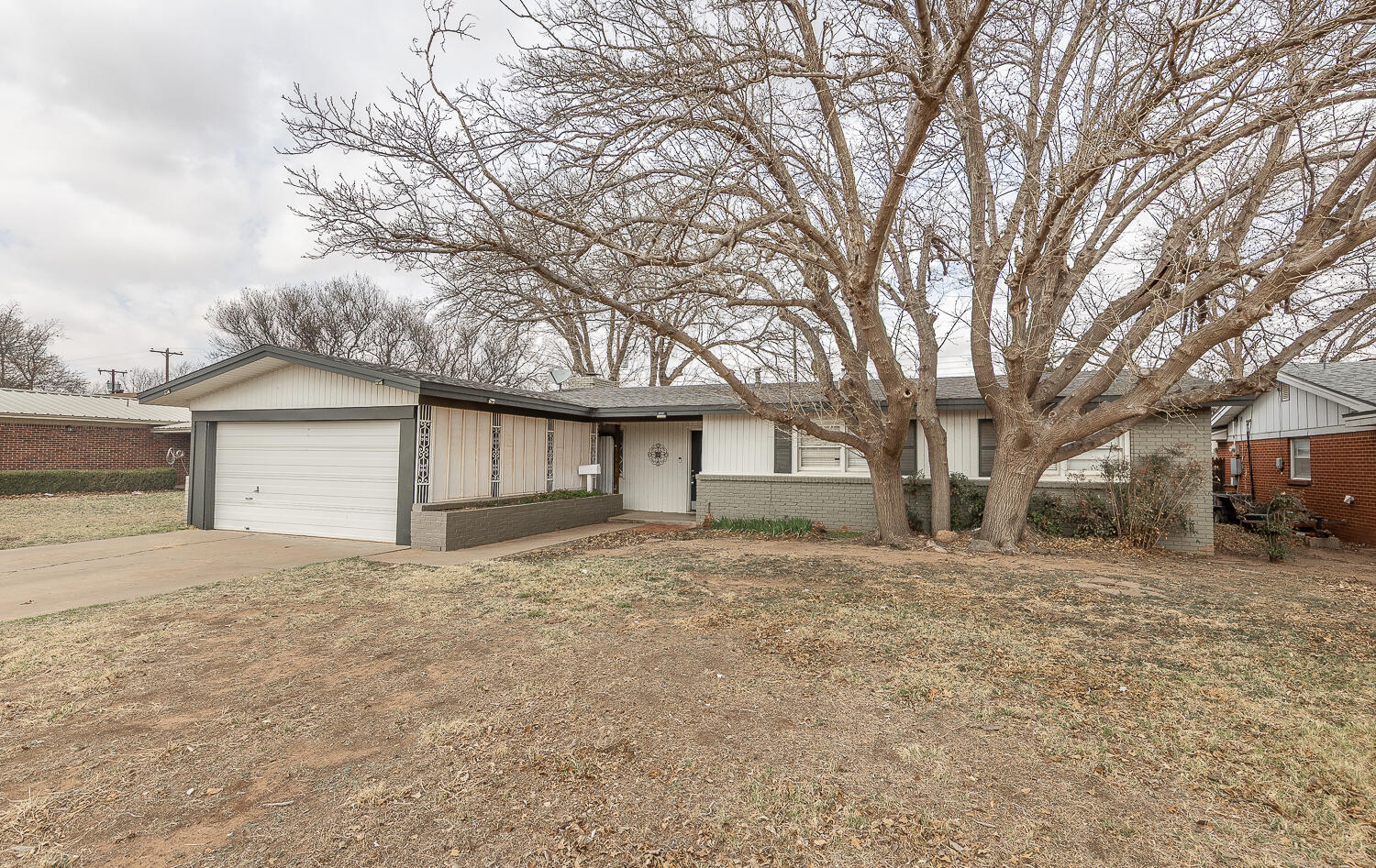 4604 31st Street Lubbock, TX 79410 - Photo 25 of 25 a yard with a large tree