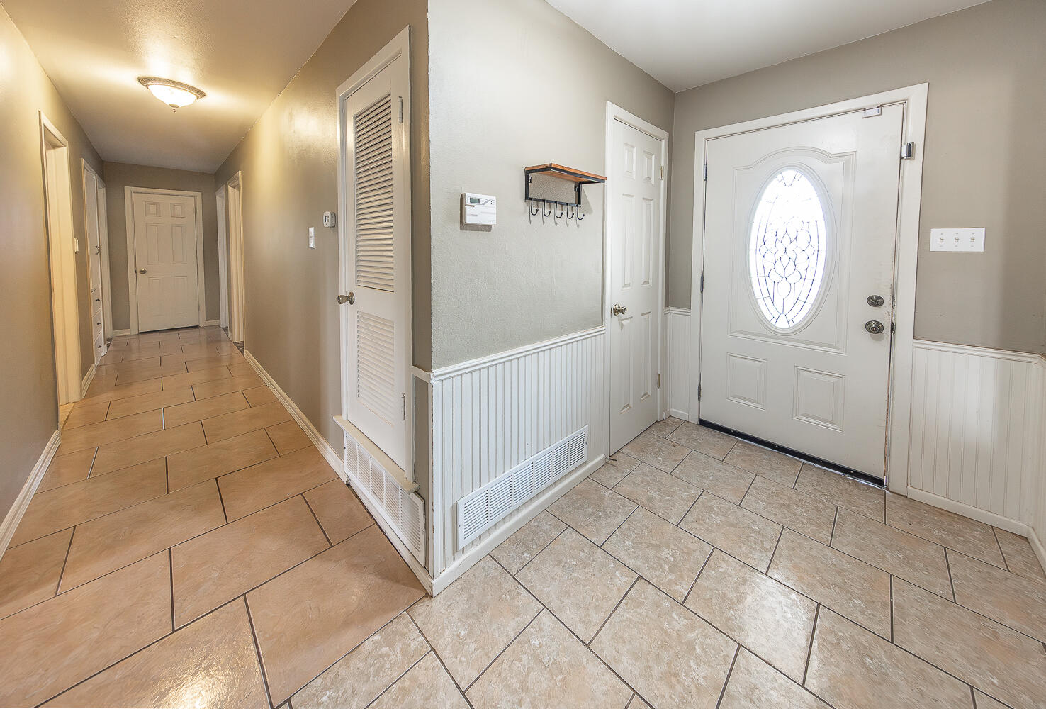 4604 31st Street Lubbock, TX 79410 - Photo 3 of 25 a view of an entryway with wooden floor