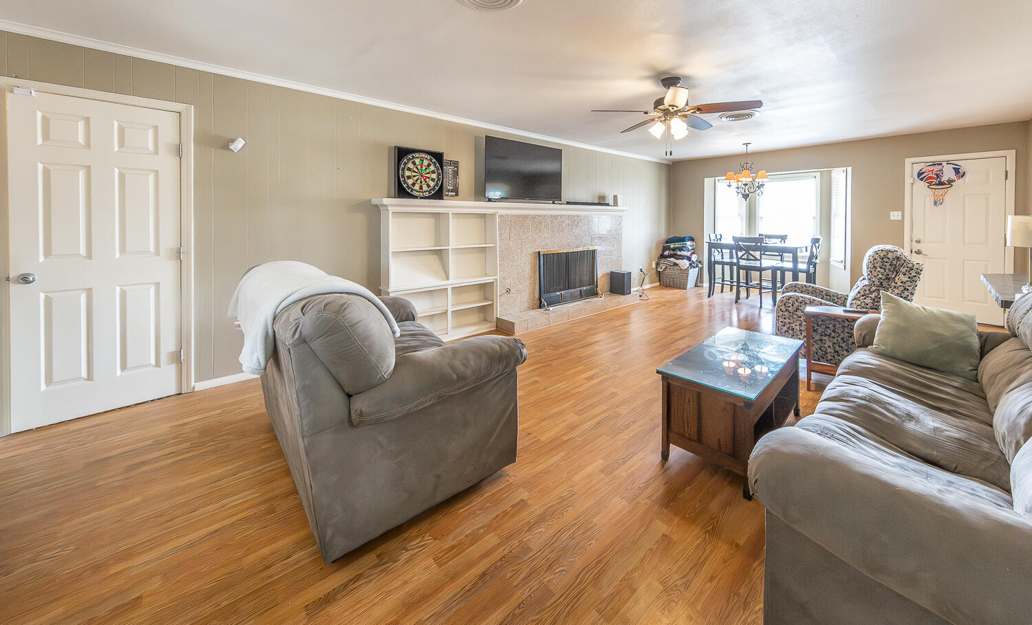 4604 31st Street Lubbock, TX 79410 - Photo 4 of 25 a living room with fireplace furniture and a wooden floor