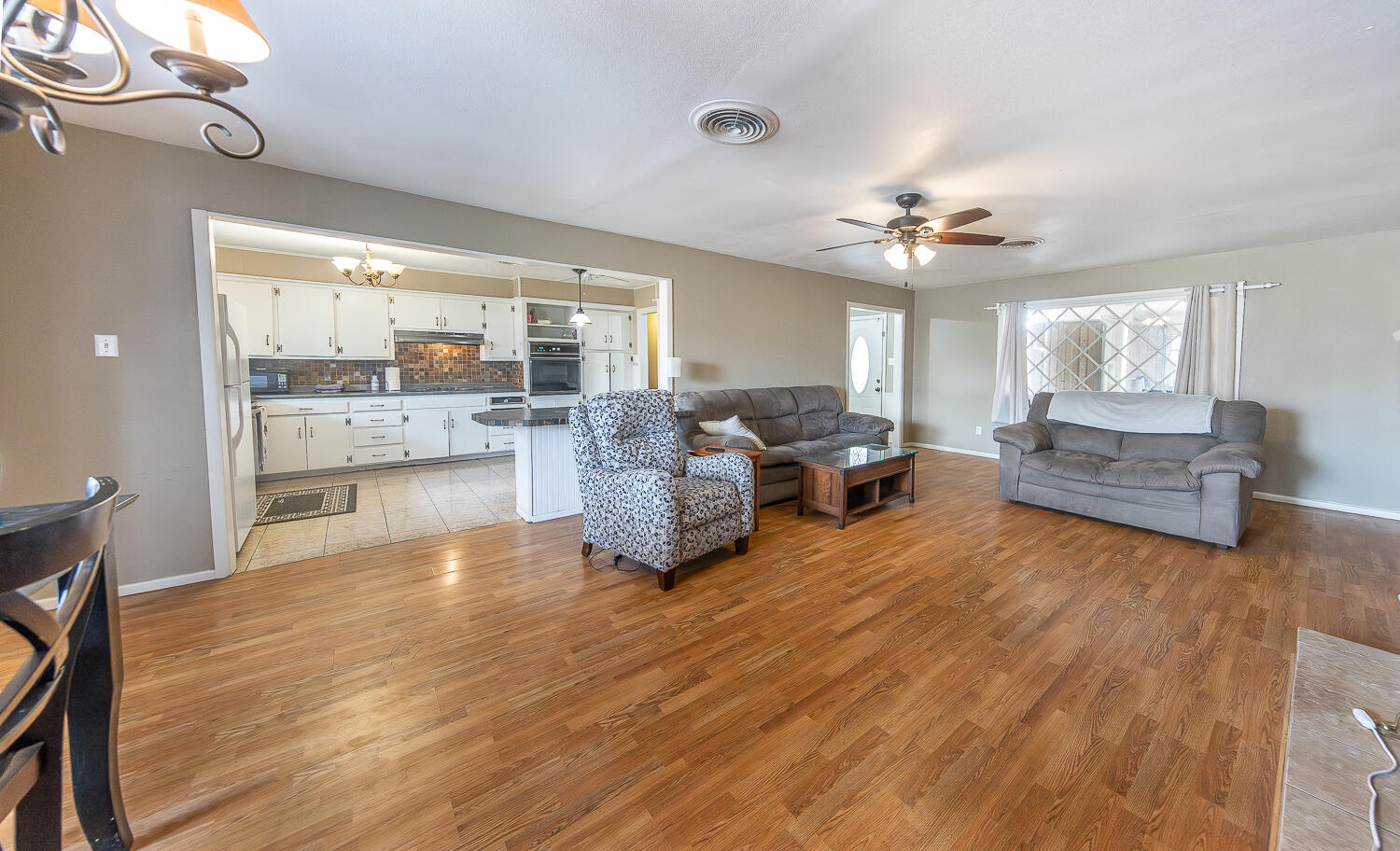 4604 31st Street Lubbock, TX 79410 - Photo 5 of 25 a living room with furniture and a large window