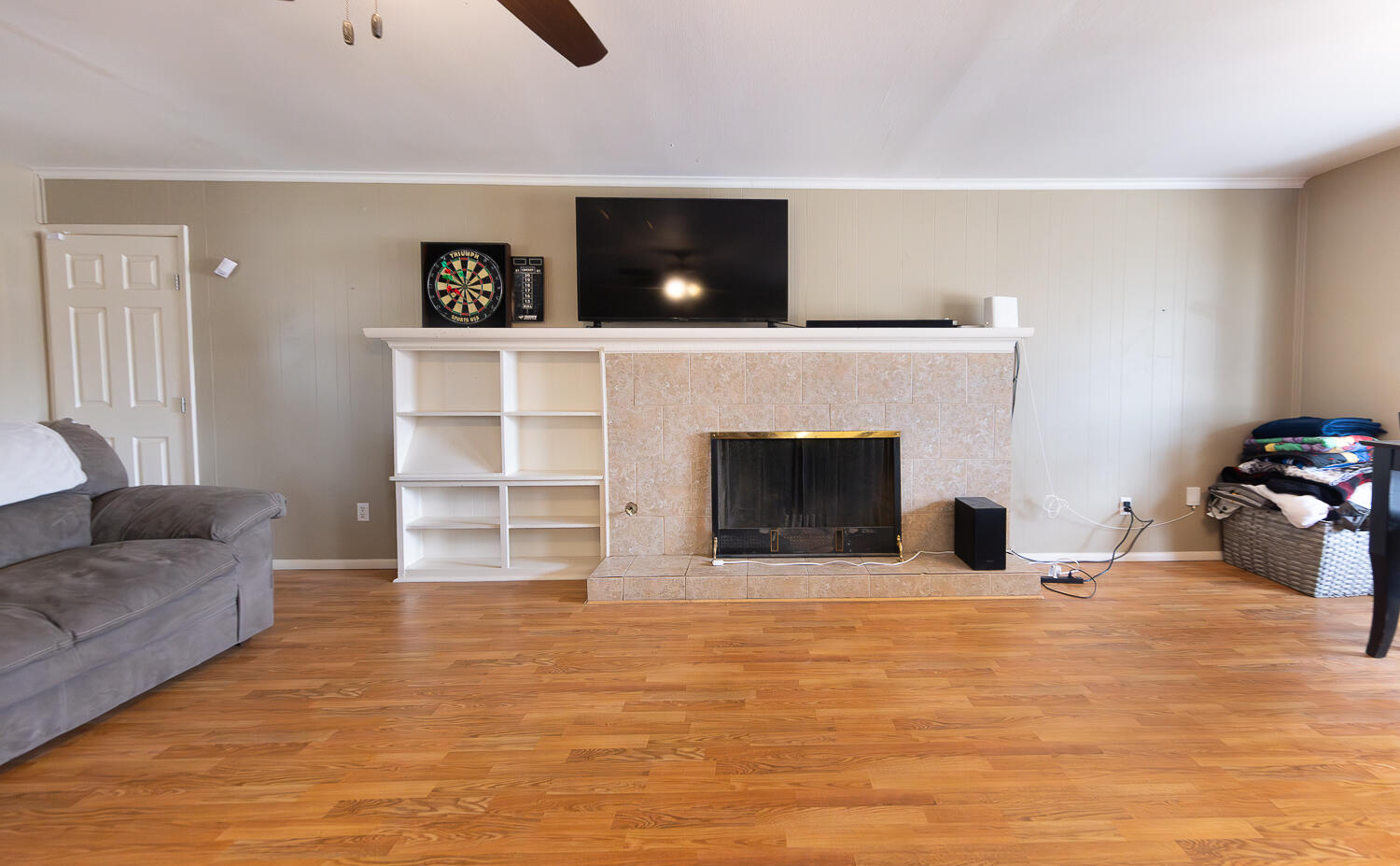 4604 31st Street Lubbock, TX 79410 - Photo 7 of 25 a living room with furniture and a fireplace