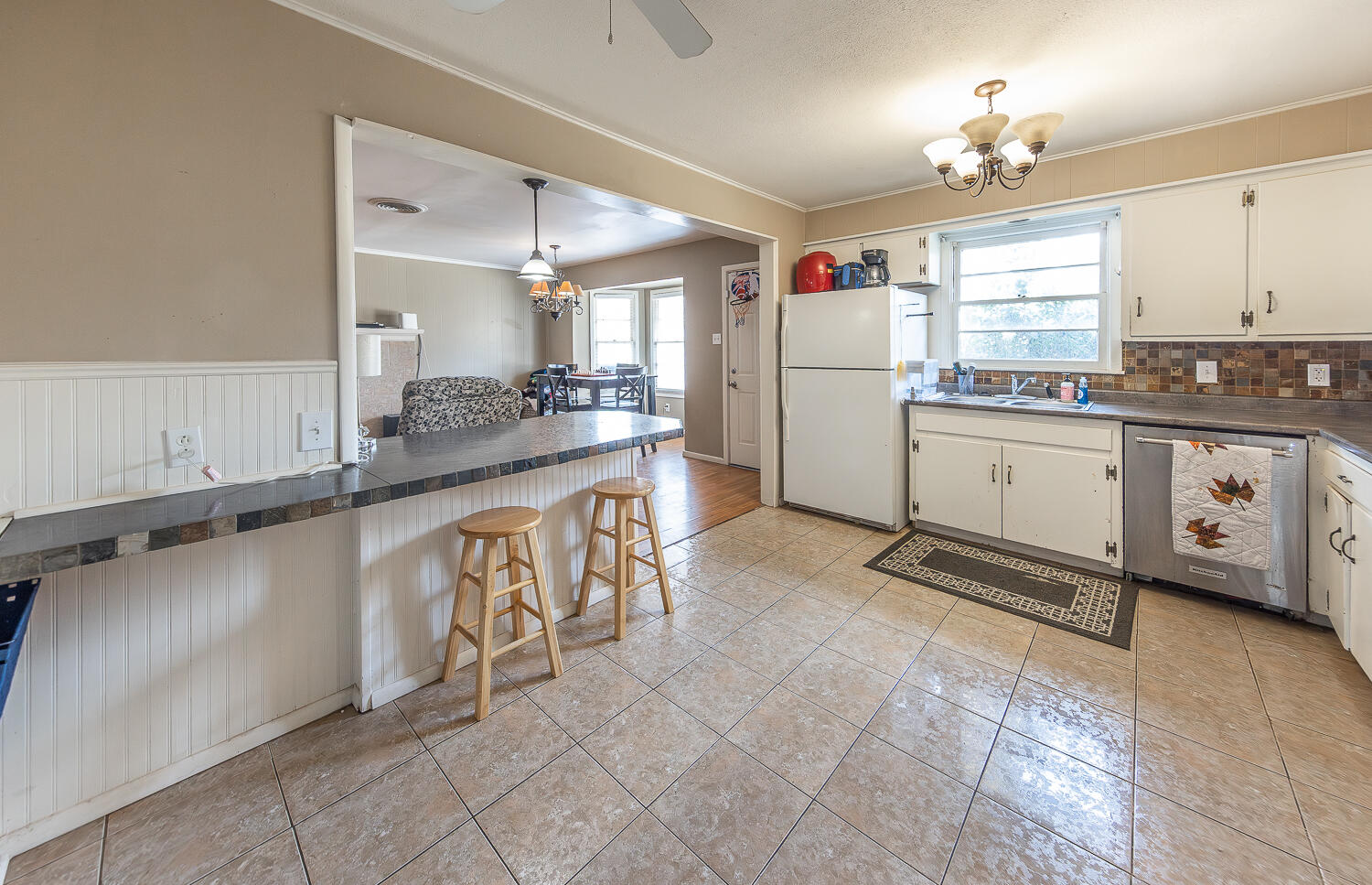 4604 31st Street Lubbock, TX 79410 - Photo 10 of 25 a kitchen with stainless steel appliances granite countertop a sink and cabinets