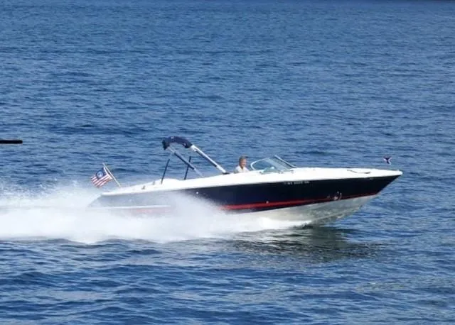 a view of staircase with wooden floor and white walls