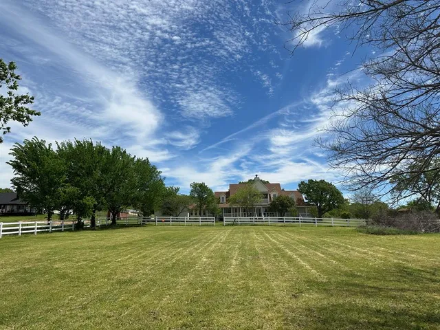 a view of a lake with houses in background