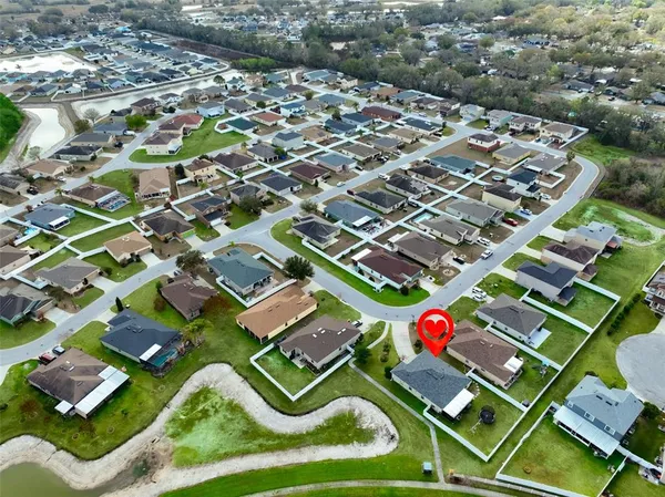 an aerial view of a house with a garden