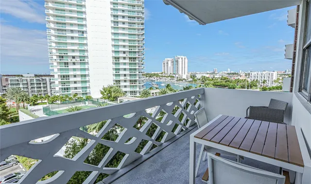 a view of balcony with wooden floor and outdoor seating