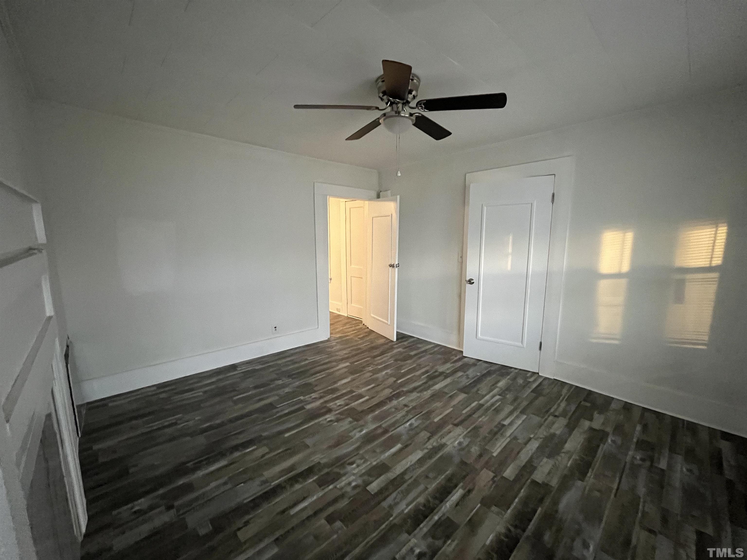 76 Lee Street Roxboro, NC 27573 - Photo 8 of 12 a view of an empty room and window